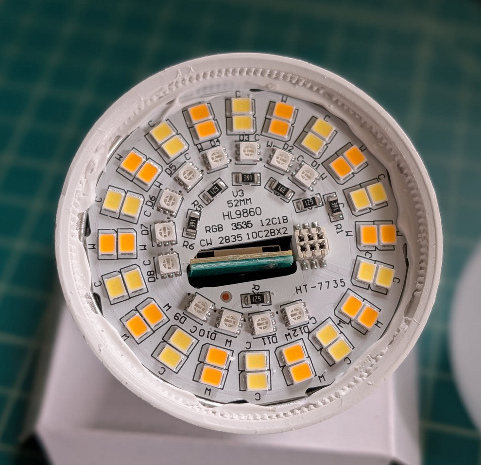 Light bulb with top removed. Exposing LEDs and circuits underneath